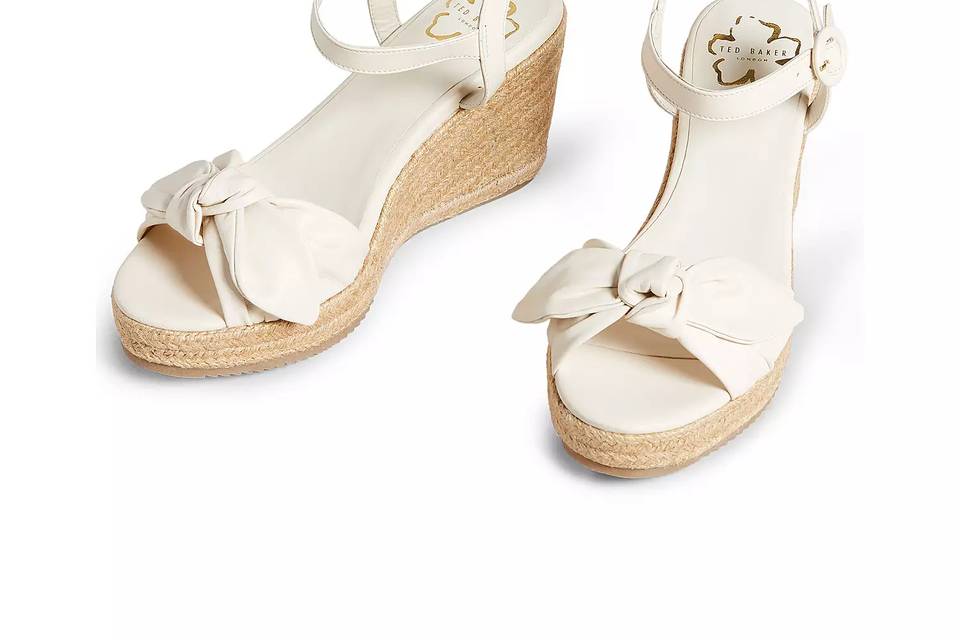 Wedge sandals with white bows and ankle straps