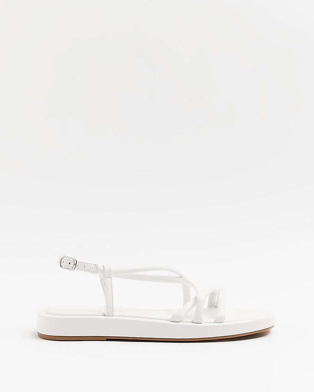 White sandal with no heel, wide fit, on a white background