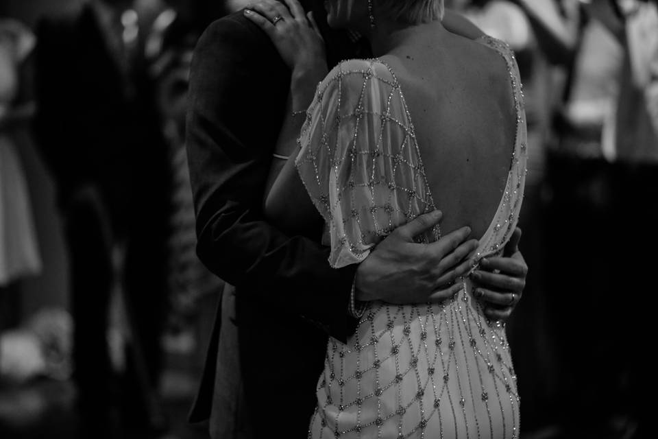 Black and white photo of a couple dancing at a wedding