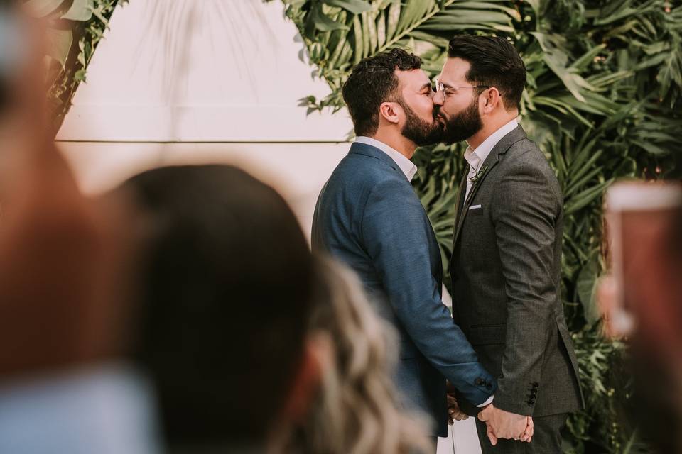 A couple kissing at their wedding