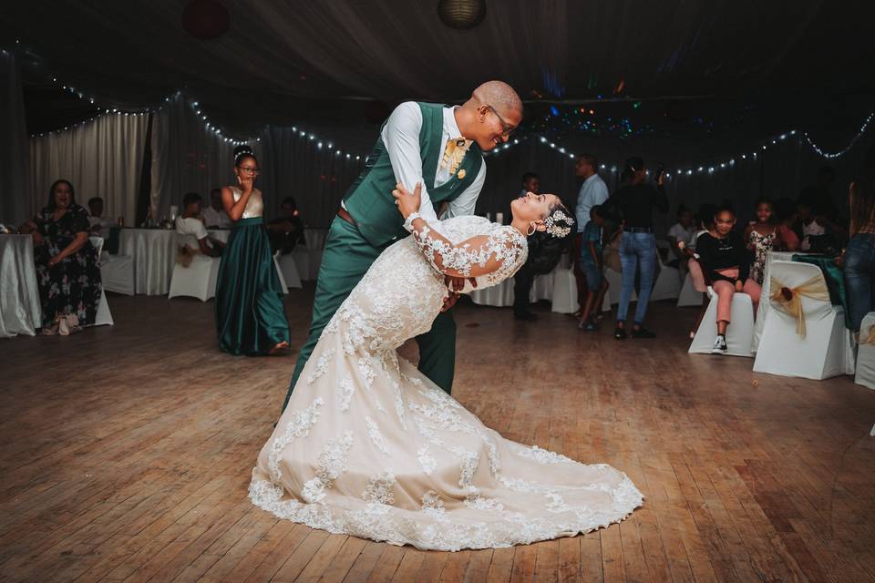 A couple dances their first dance at their wedding