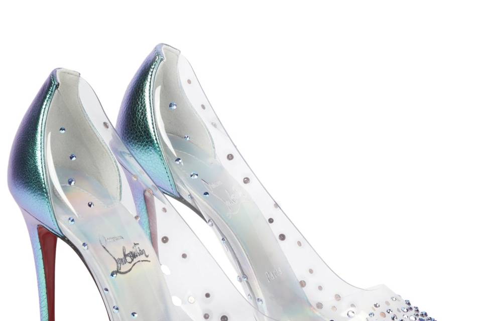 Image of iridescent Louboutin pumps against a white backdrop