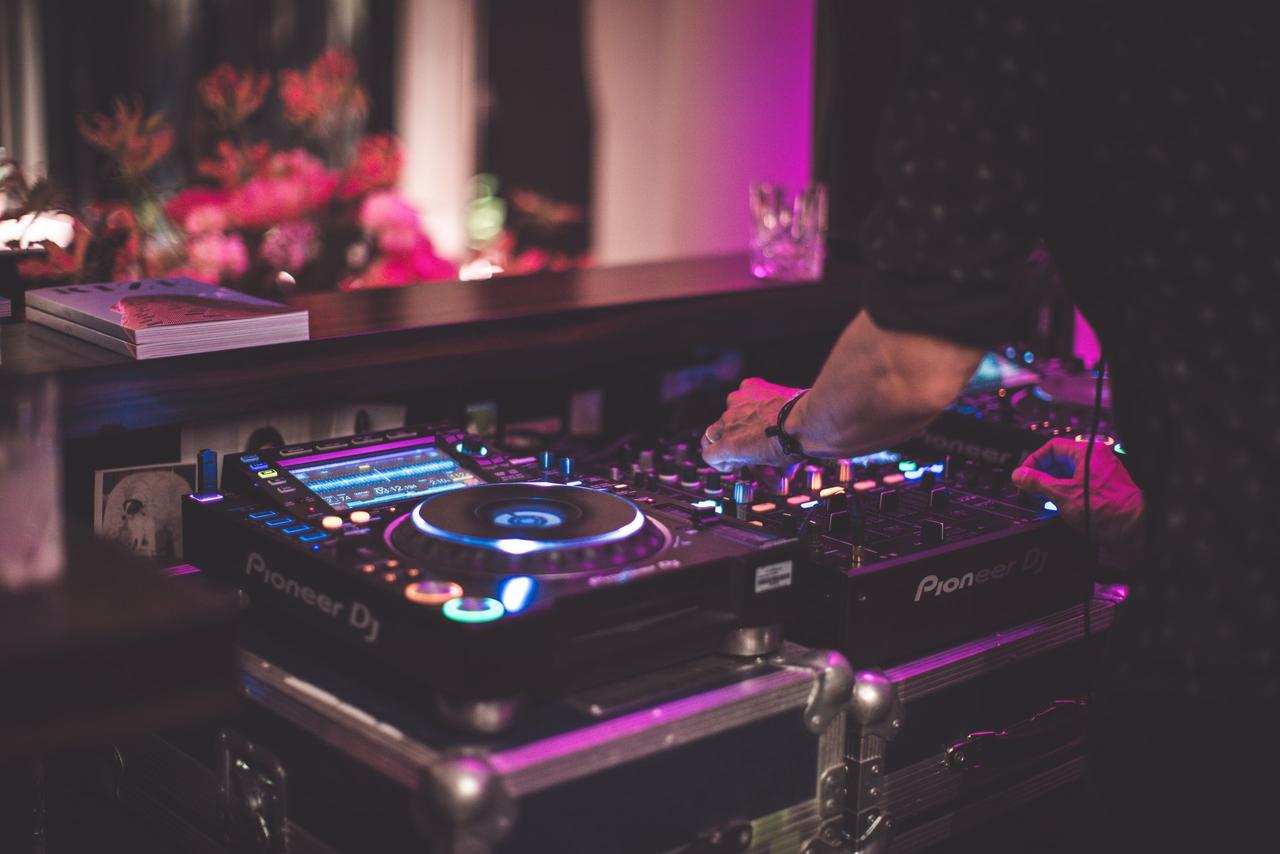 A DJ plays music using his turntable