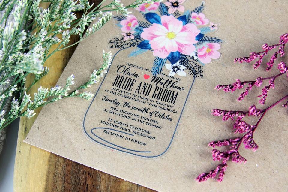 Wedding invitation on brown craft paper with flower motifs