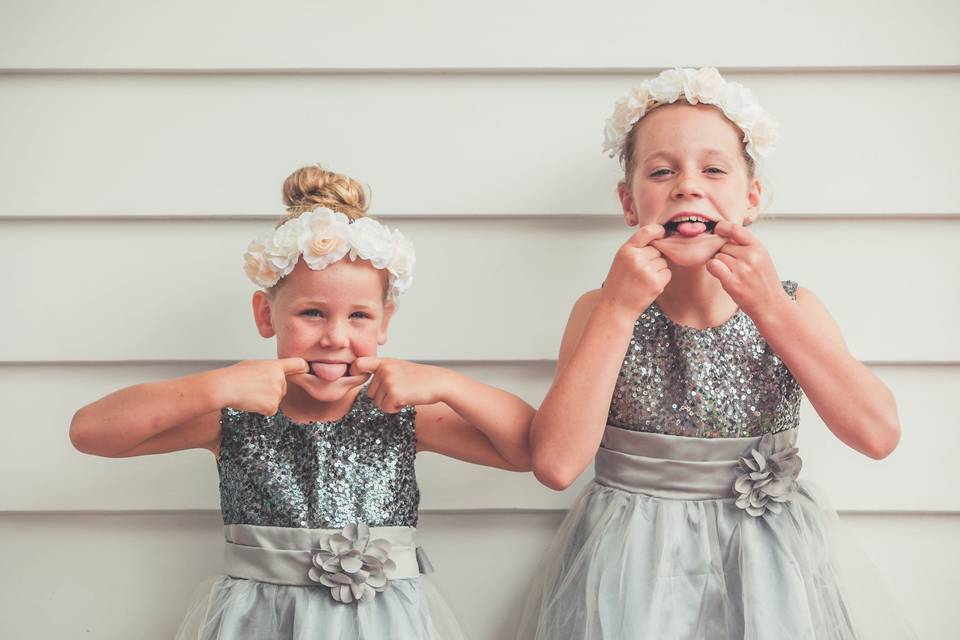 Young bridesmaids pulling funny faces