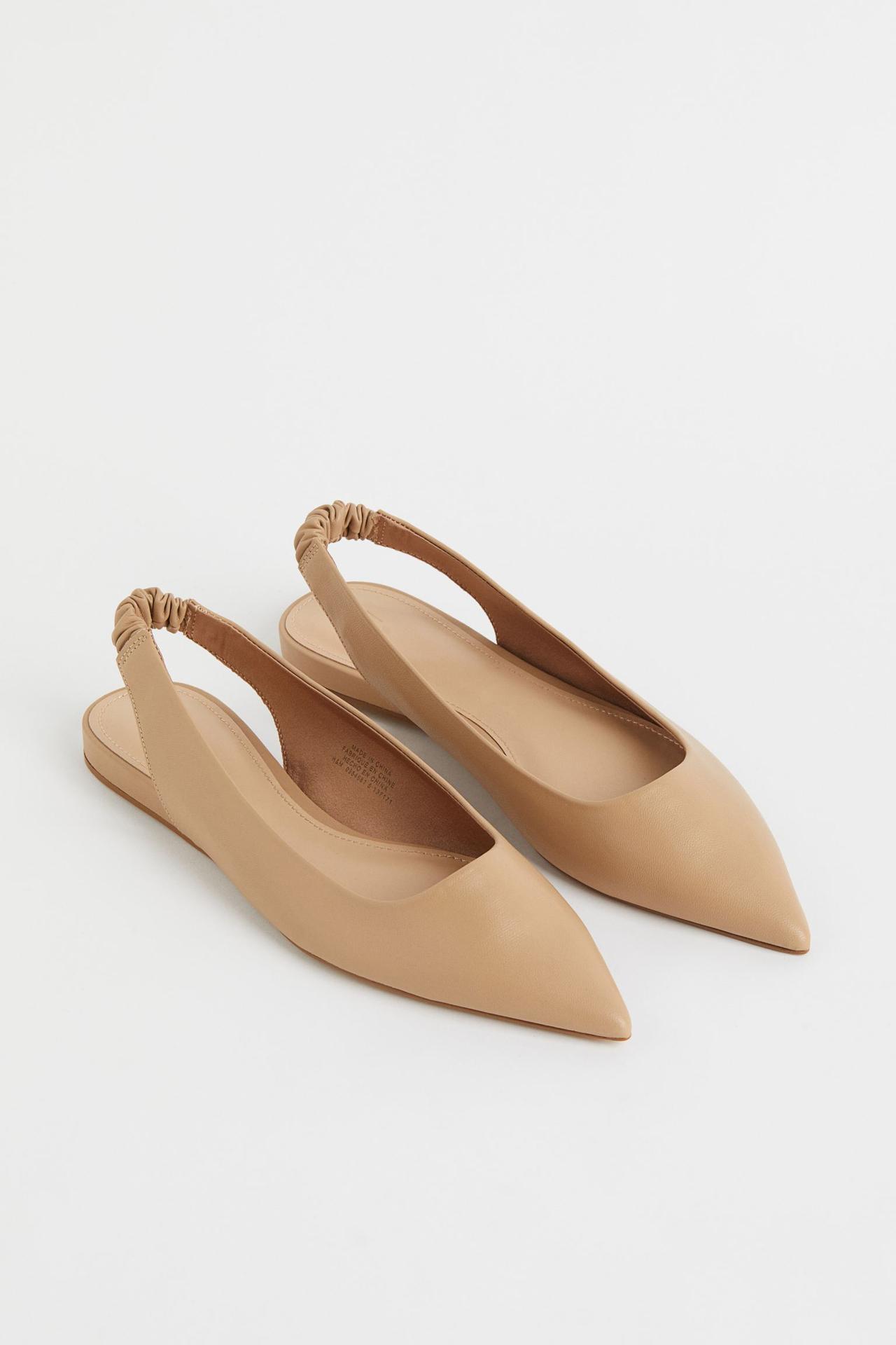 Neutral-hued pointed toe slingbacks with a satin lining and imitation leather