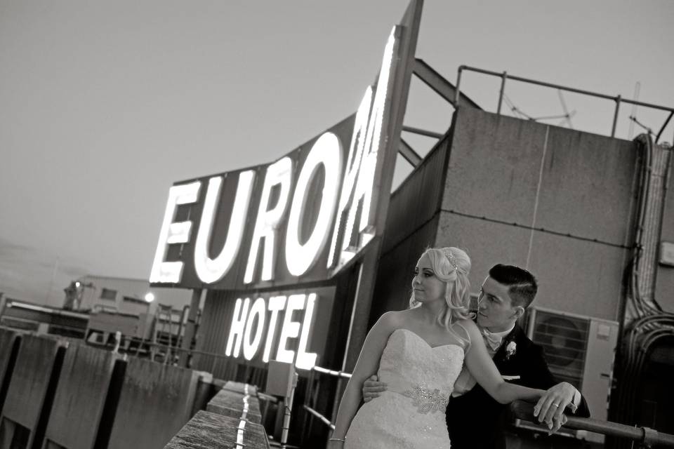 Europa Hotel sign and couple