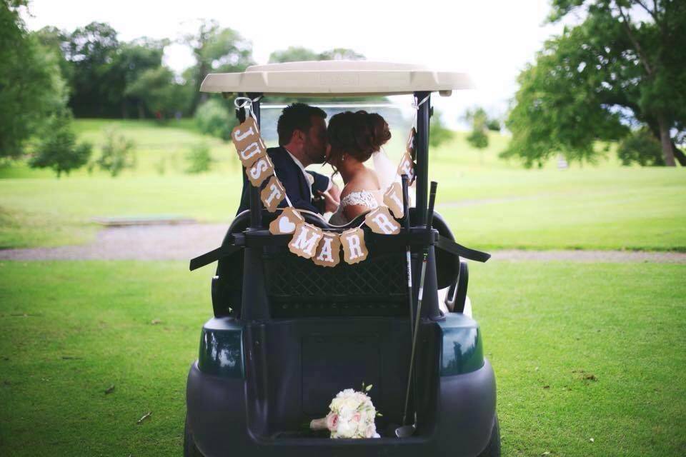 Couple in golf cart