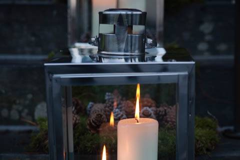 Lanterns with moss and fir cones