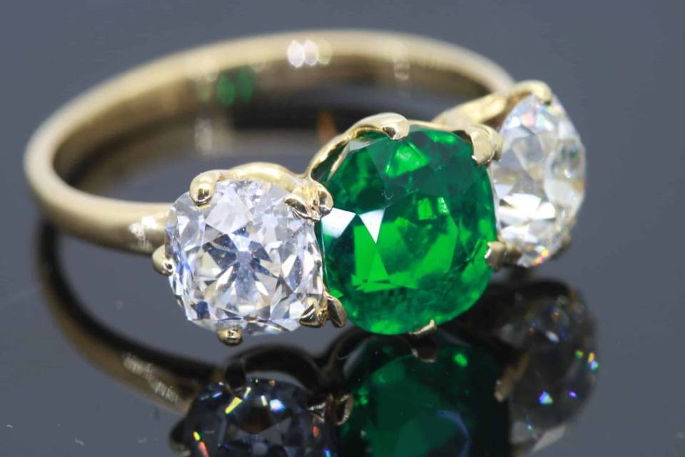 Important emerald and diamond three stone ring