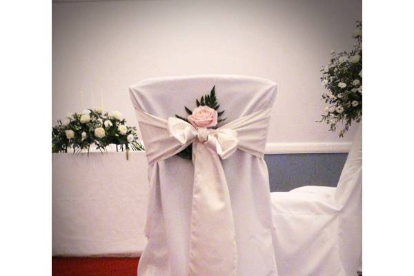 Chair covers and floral arrangement