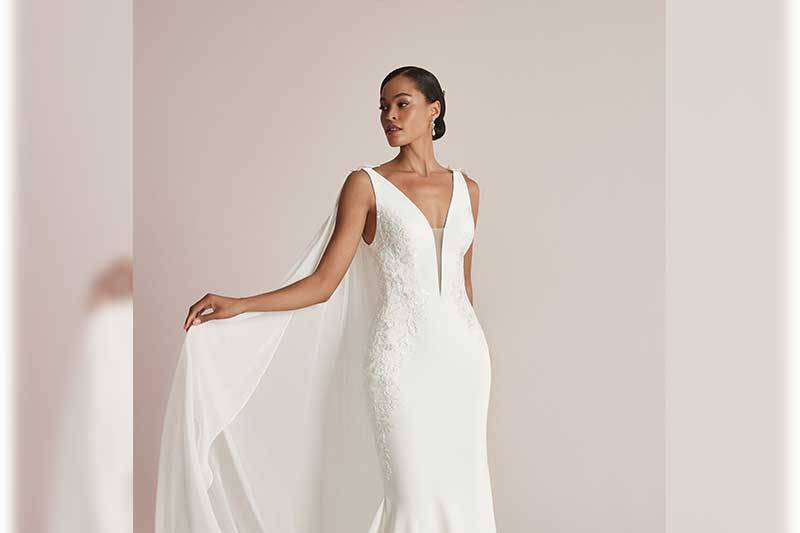 Feminine fitted crepe and lace gown with narrow plunging V-neckline