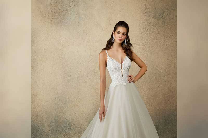 Beaded alencon lace appliques on and English net ballgown with scalloped lace hemline