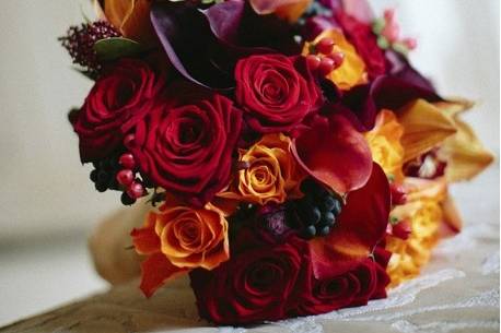 Autumnal bouquet with red and orange blooms